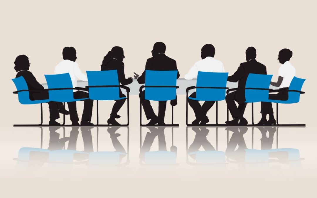 Silhouette image of board members at a table